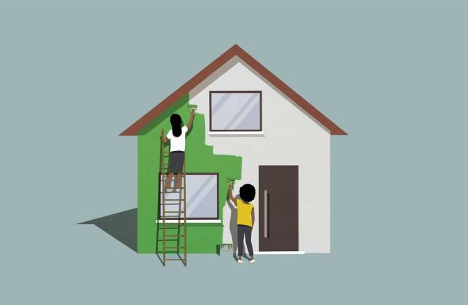 A house being painted green