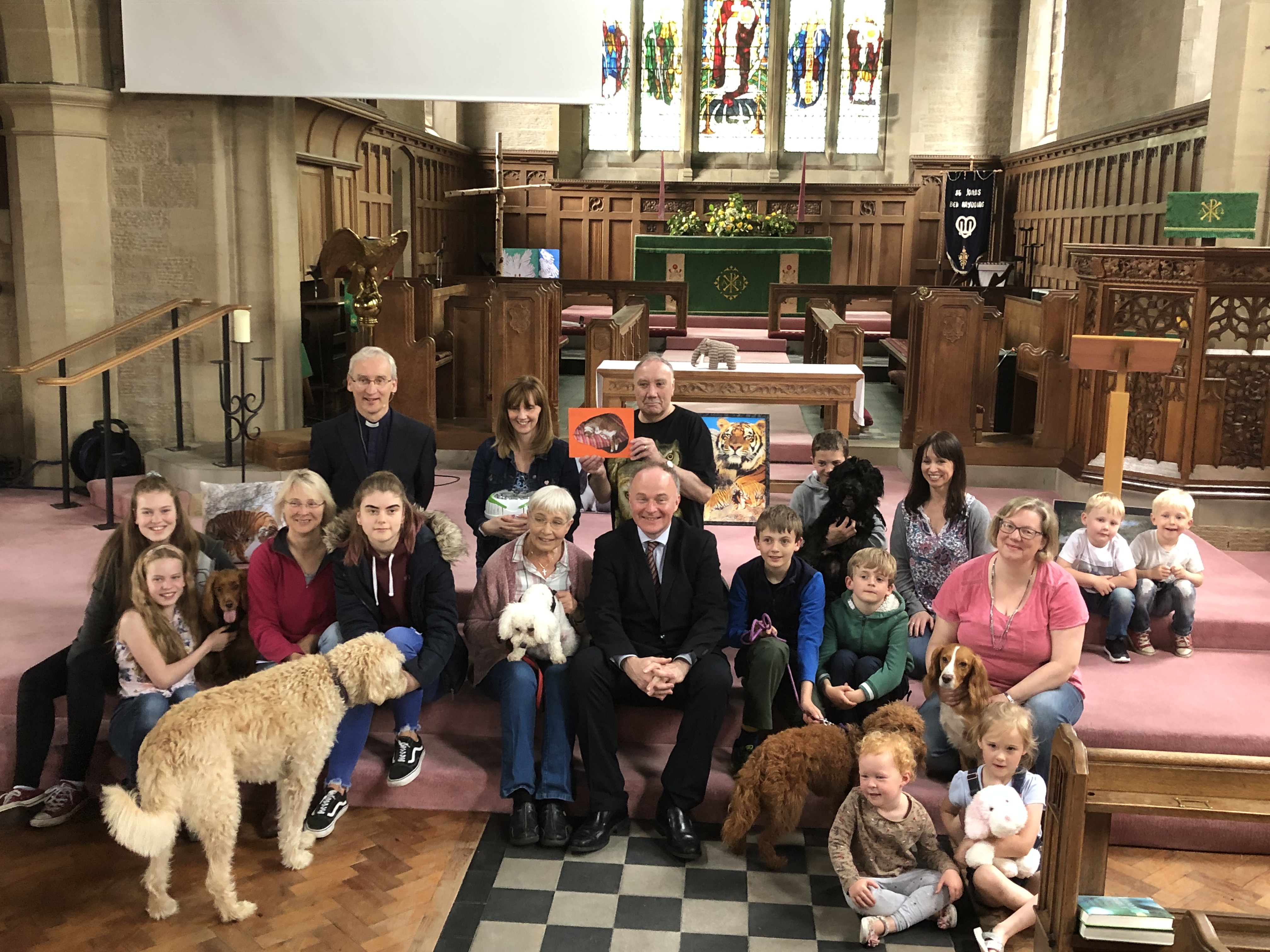 Congregation hold an animal blessing service with pets.