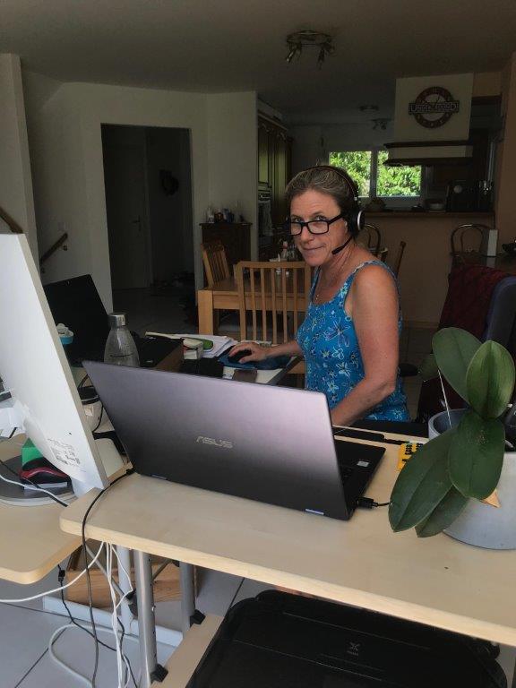 Woman working at a computer from home