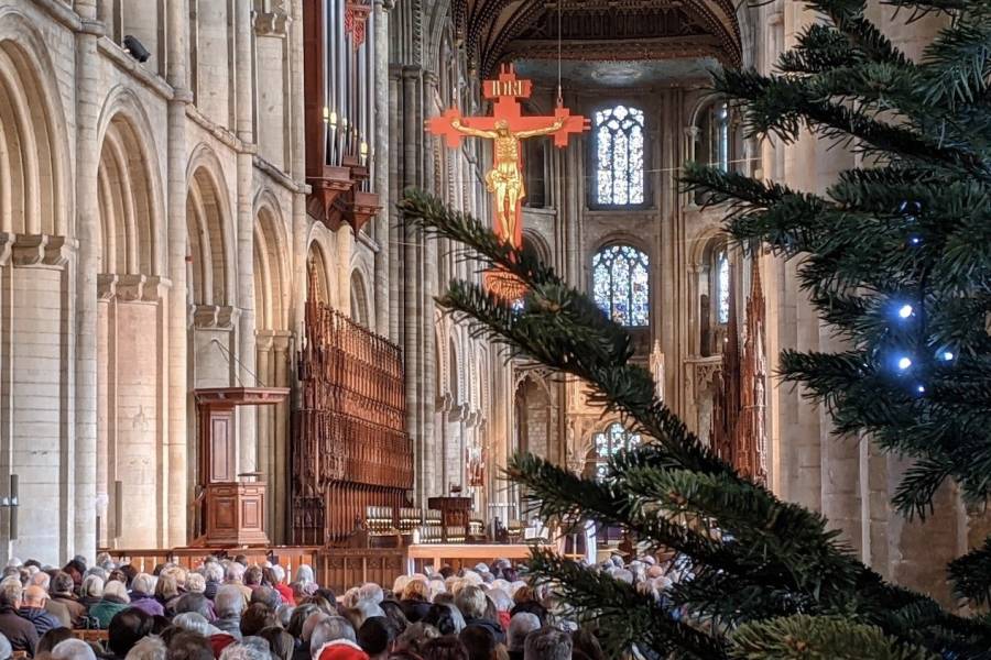 Interior of a Cathedral showing edge of Christmas Tree
