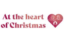 At the Heart of Christmas campaign logo consisting of a red heart with white outlines of the Holy Family