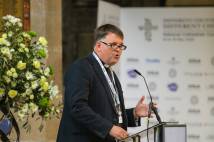 The Bishop of Norwich at a Lectern addressing the cathedrals conference