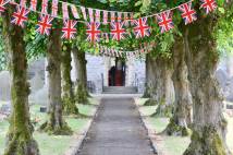 Church celebrating Jubilee/Coronation/other Royal event with bunting in churchyard