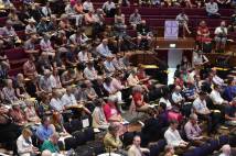 Members of the General Synod listen to a debate at the University of York's Central Hall