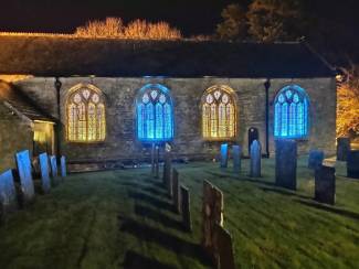 Wadebridge parish church in north Cornwall lit up in colours of Ukraine