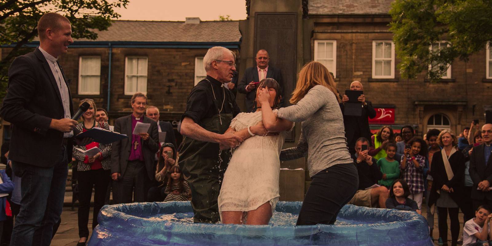 Adult baptism outside with Archbishop of Canterbury 