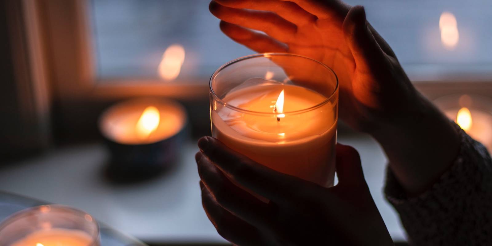 A person holding a candle