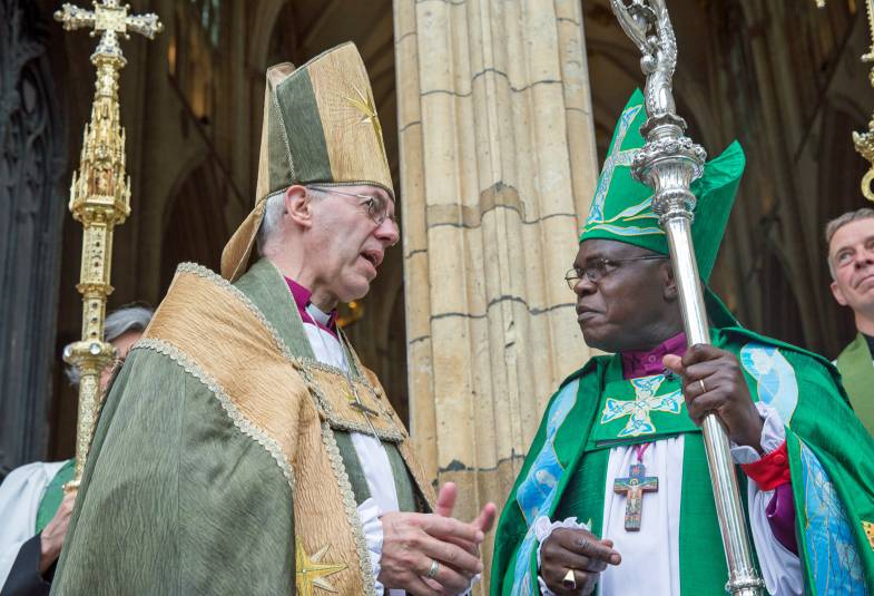 Archbishops of York and Canterbury face each out outside cathedral 
