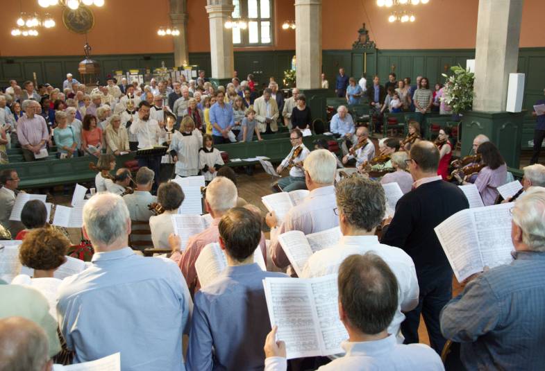 Musical performance, choir and musicians performing for audience in church