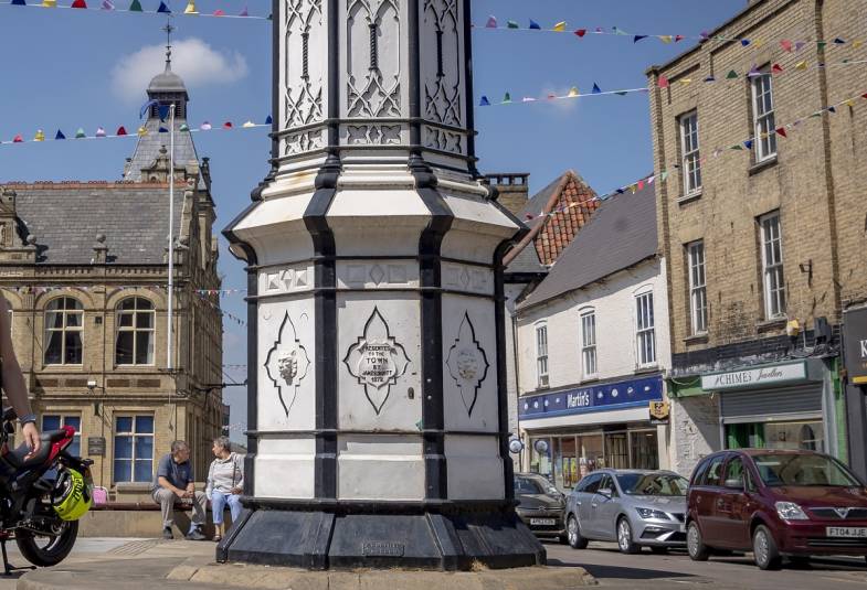 Base of the clock in Downham Market on a sunny day