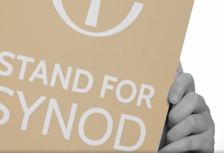 A placard with the text "Stand for Synod" written on.