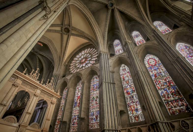 The nave of Durham Cathedral is shown complete with stained glass windows
