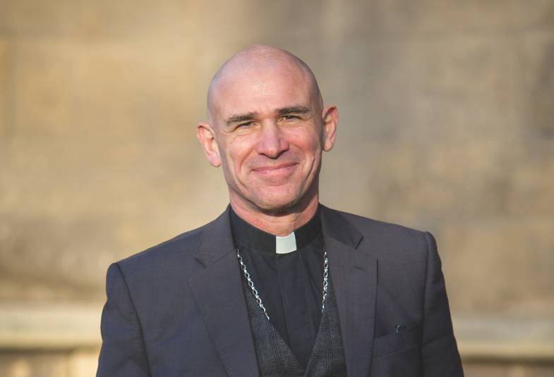 The Bishop of Sheffield is shown in portrait mode smiling 