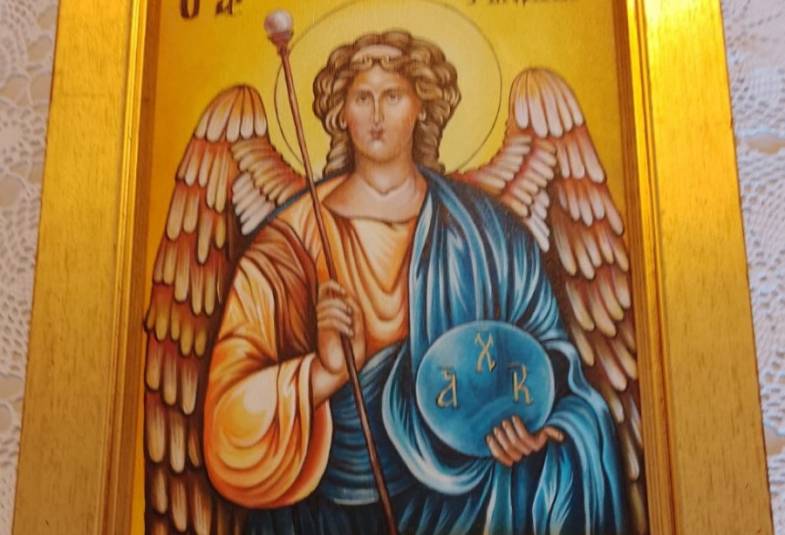 Gold framed painting of an angel 