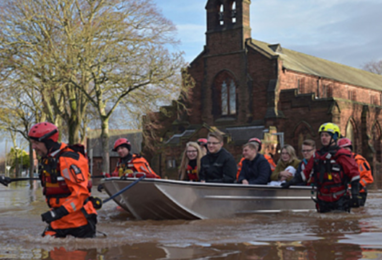 Residents are evacuated on a small boat