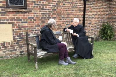 Ric's Bench pictured with Vicar and a parishioner 