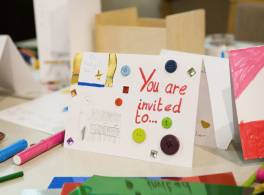Child's handmade card reading "You are invited"