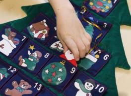 A patchwork Advent calendar in the shape of a Christmas tree