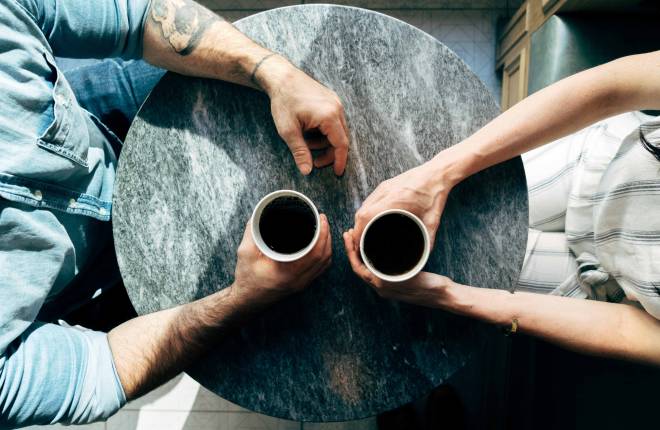 Birdseye view of two people having coffee
