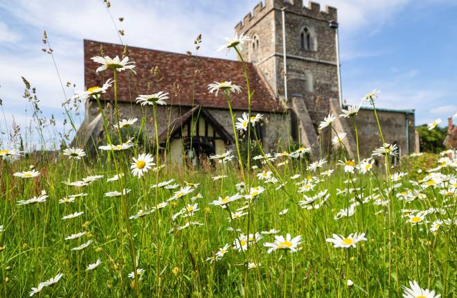 A church with wild flowers to the fore