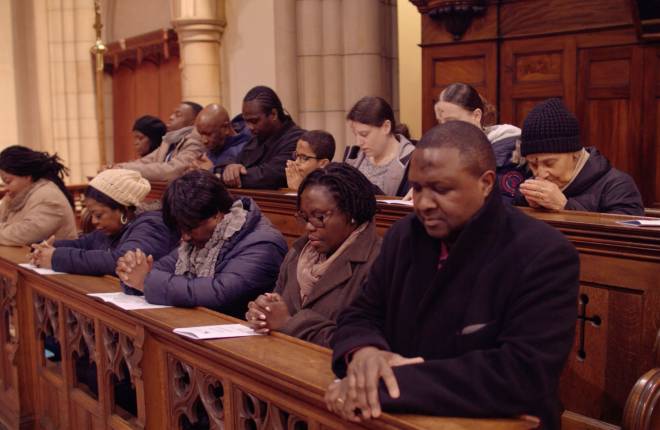 Congregation at prayer in the pews