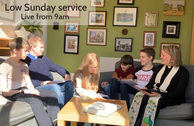 A family gathered around a table taking part in a Sunday Service.