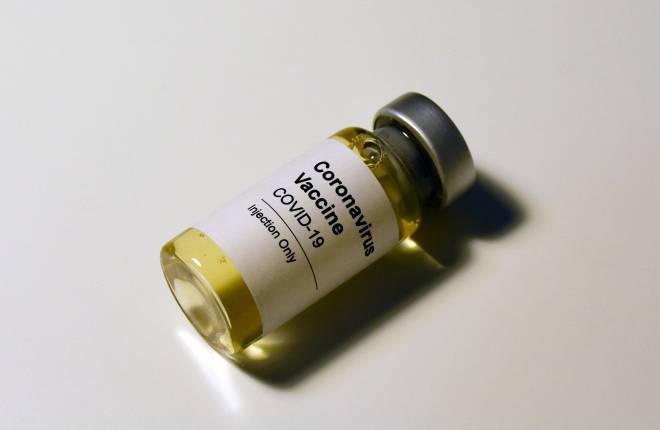 A vial of Covid-19 vaccine is shown in a colour photograph 