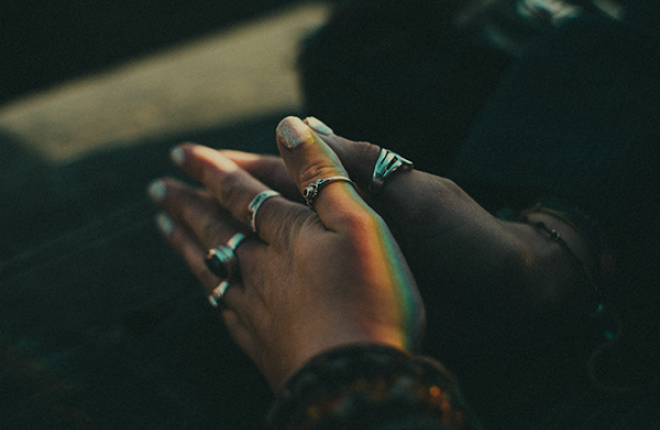 A person's hands closed together in prayer.